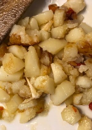 Una foto de Patatas con pimientos rojos