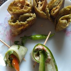 A picture of Cucumber rolls with dal cheela rolls.