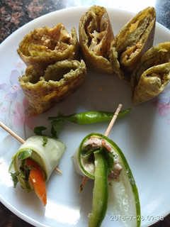 A picture of Cucumber rolls with dal cheela rolls.