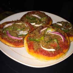 A picture of Mini cheeseless pizza 🍕.