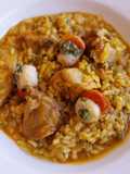 Arroz meloso de costillas, calamar y vieiras