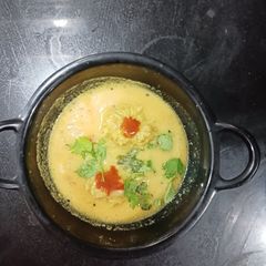 A picture of Dudhi muthia with gravy (from leftover rice).
