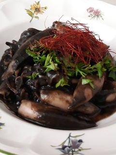 Una foto de Calamares en su tinta
