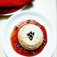 Vanilla Panna cotta in Strawberry Sauce A picture of Vanilla Panna cotta in Strawberry Sauce.
