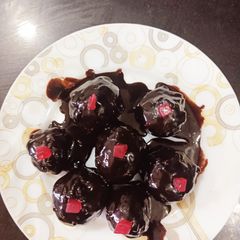 A picture of Stuffed Dates in ganache.