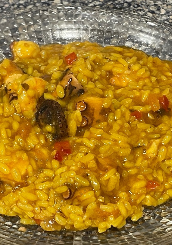 Una foto de Arroz meloso con pulpo y langostinos