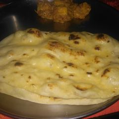 A picture of Butter naan with hotel style paneer Butter masala.