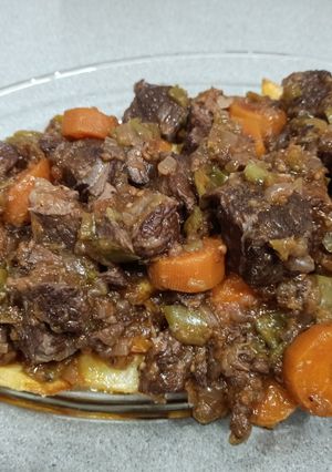 A picture of Beef Stew in Pressure Cooker with French Fries.