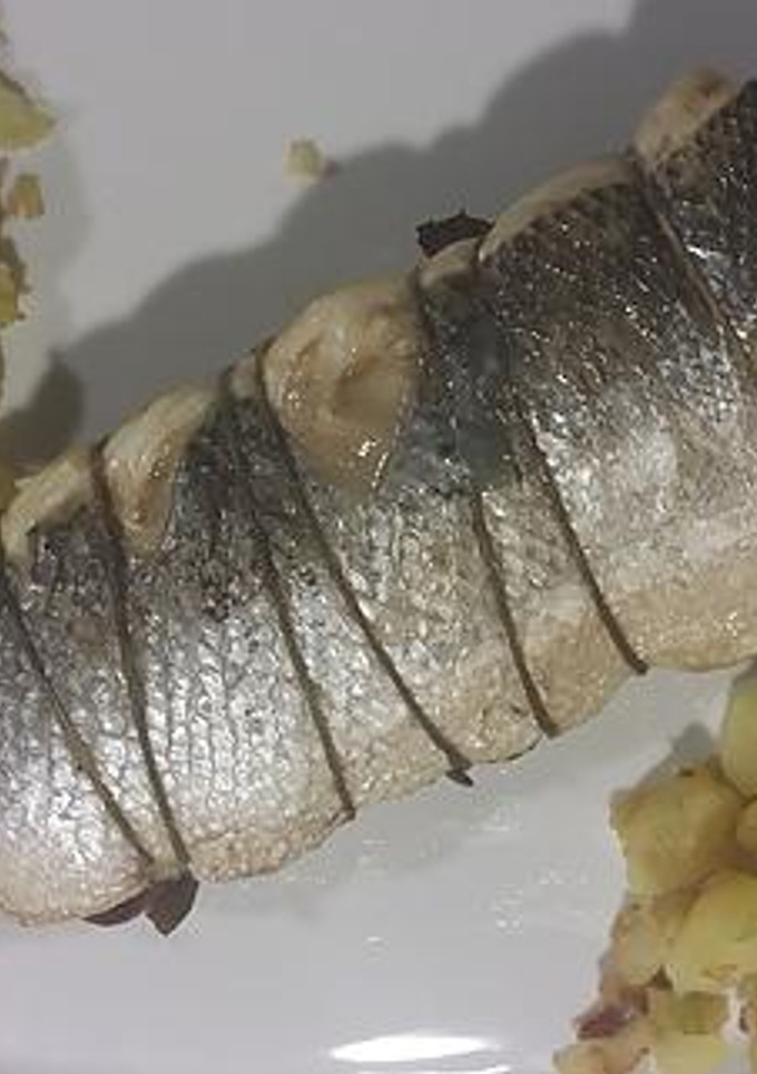 Una foto de Lubina rellena de champiñones