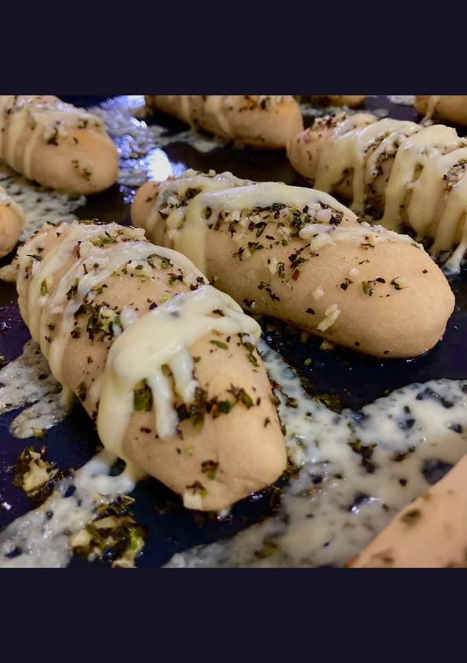 Una foto de Palitos de ajo y queso
