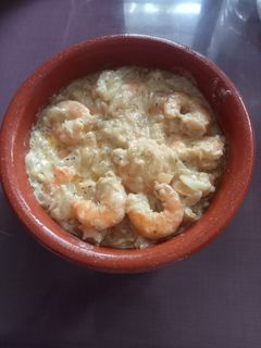 Una foto de Langostinos con crema de curry