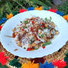 A picture of Aloo tikki chana chat.