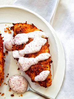 A picture of Parmesan-oregano crusted chicken with sumac dressing.