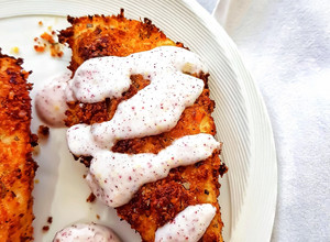 A picture of Parmesan-oregano crusted chicken with sumac dressing.