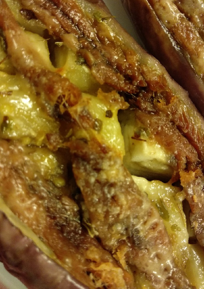 Una foto de 9.🍆Berenjenas con anchoas, orégano y parmesano🧀