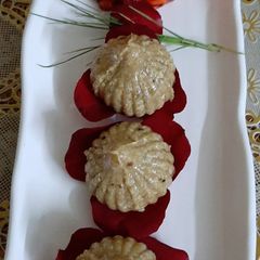 A picture of Chapati, Oats Churma Modak.