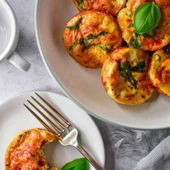 A picture of Baked Egg Cups With Smoked Bacon, Basil & Tomato.