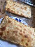 Empanada casera de atún con huevo cocido y de bacon con queso