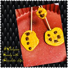 A picture of Dalgona candy with chocolate chips.