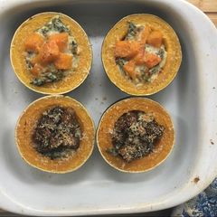 A picture of Creamed Spinach and mushroom stuffed Gem Squash with butternut.