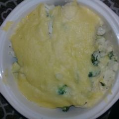 A picture of Broccoli and courflower in sauce.