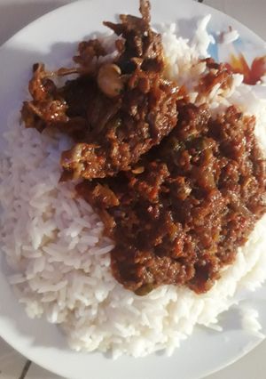 A picture of Rice with peppered stew.