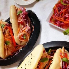 A picture of Chicken Stuffed Chinese Steam bun with pickled vegetables.