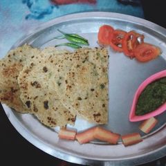 A picture of Rice and wheat flour ki roti.