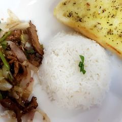 A picture of Stir fry beef and rice.