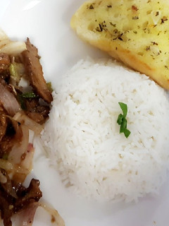 A picture of Stir fry beef and rice.
