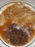 Bistec de puerco con cebolla y papas en salsa de jitomate