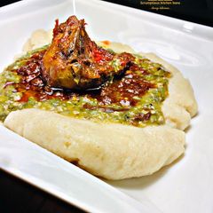A picture of Semovita (swallow)with okra soup and stew.