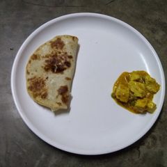 A picture of Butter naan and dahi paneer.