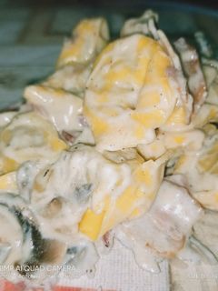 Una foto de Raviolis a la carbonara