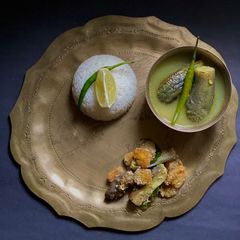 A picture of Korui Begun diye Moong Dal / Moong Dal with Small Eggplants for lunch in Thakurbari style.