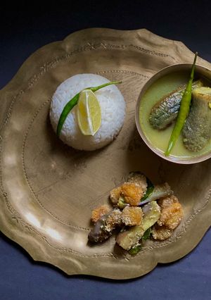 A picture of Korui Begun diye Moong Dal / Moong Dal with Small Eggplants for lunch in Thakurbari style.