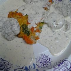 A picture of Creamy flats over a vegetable egg cake.
