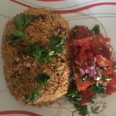 Beef pilau served with kachumbari A picture of Beef pilau served with kachumbari.