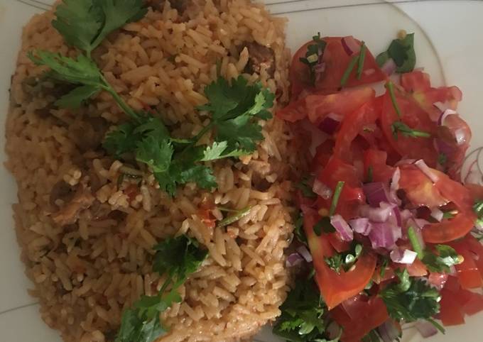 Beef pilau served with kachumbari