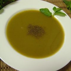 A picture of Tomato Soup with Coriander Stems & Mint Leaves.