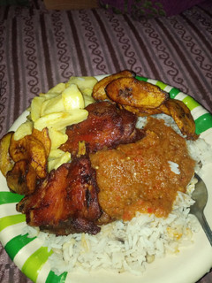 A picture of Rice beans plantain chips en chicken.