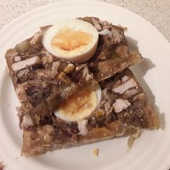 A picture of Sig's German Jellied Meatloaf with Egg.