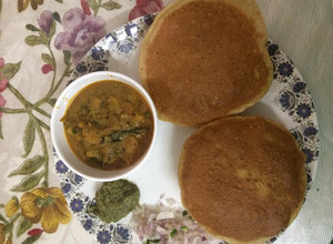 A picture of Crispy rava poori with potato sabji.