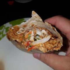 A picture of Sweet twisted pulled chicken wrap.