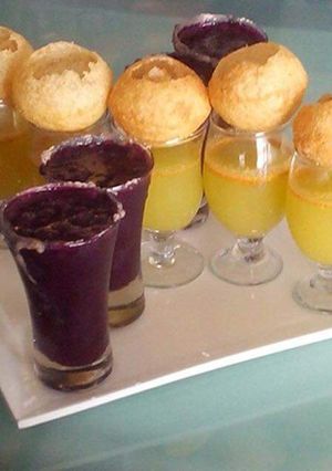 A picture of Pani Puri with fruit shots.