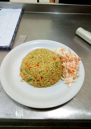 A picture of Jollof Rice with coslow.