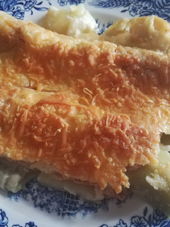 Una foto de Puerros con bacon a la bechamel gratinados
