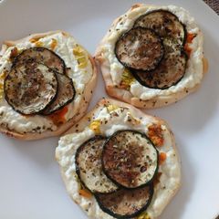 A picture of Fluffy's yummy tartlets with goat's cheese & pumpkin flowers.