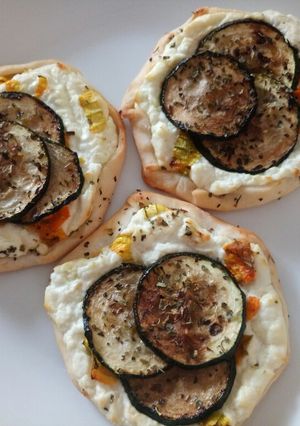 A picture of Fluffy's yummy tartlets with goat's cheese & pumpkin flowers.