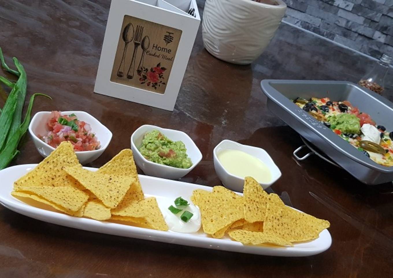 Cheese nachos with salsa and guacamole